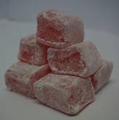 A pile of red and white candy

AI-generated content may be incorrect.